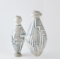The Spindel Vase Grey Blue by Global Views/Surya features two Portuguese ceramic vases with a speckled gray finish and abstract blue and white linear designs, each hand-painted with rounded shoulders and narrow necks, displayed on a plain light background.