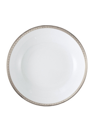 A white porcelain plate from Bernardaud's Athena Platinum Dinnerware, featuring a subtle silver geometric rim pattern, is photographed from above against a white background.