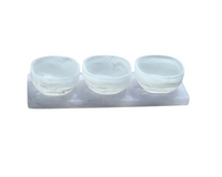 The BT- Shalom Dawn Resin Swirl 3 Dip Bowl Set in white features three small round translucent bowls arranged on a rectangular tray, perfect for serving dips.