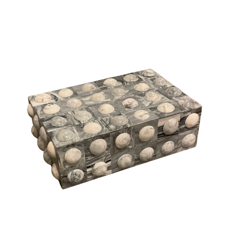 The Moondrops Grey & White Box by A Sanoma Inc is a rectangular jewelry storage box featuring a mosaic of grey and white marble squares, each topped with a domed marble accent for striking decoration.