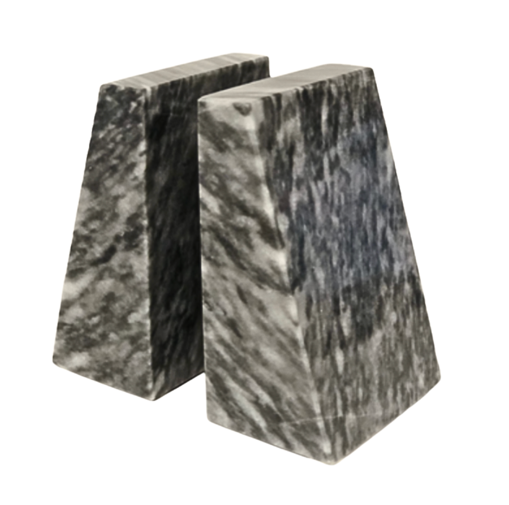 The Zeus Marble Bookend Set by Designs by Marble Crafter features two trapezoidal, black and white marble bookends placed closely together on a white background, adding a sophisticated touch of elegant home decor.