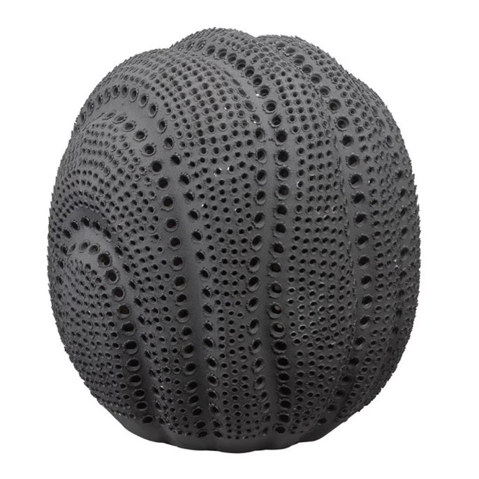 The Solar Sphere - Black by Jamie Young is a round, black sea urchin-inspired piece with a bumpy texture and rows of small holes, resembling a celestial vase or intricate decorative ceramic.