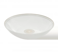Christofle’s Malmaison Imperiale Porcelain Dinnerware Platinum bowl features a subtle platinum decorative pattern around the rim and an intricate central design, all set on elegant white porcelain.