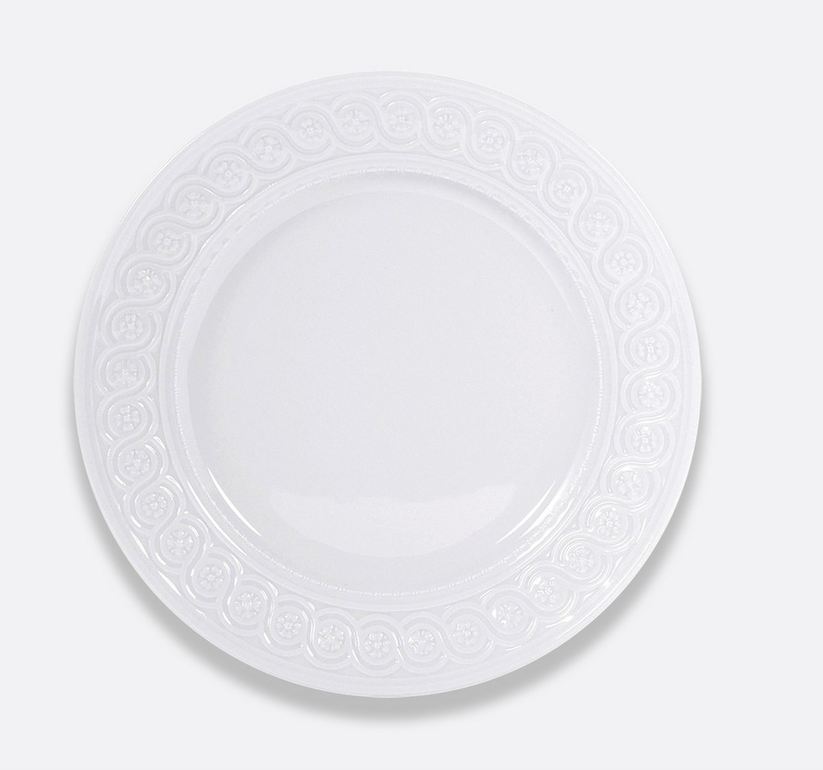 The Bernardaud Louvre Dinnerware features a plain white ceramic plate with a Renaissance-inspired embossed border, shown from above on a light gray background.
