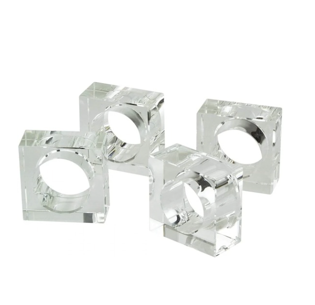 The Tizo Crystal Napkin Ring Set of 4 features clear, square rings with circular openings, adding modern elegance to any table setting.