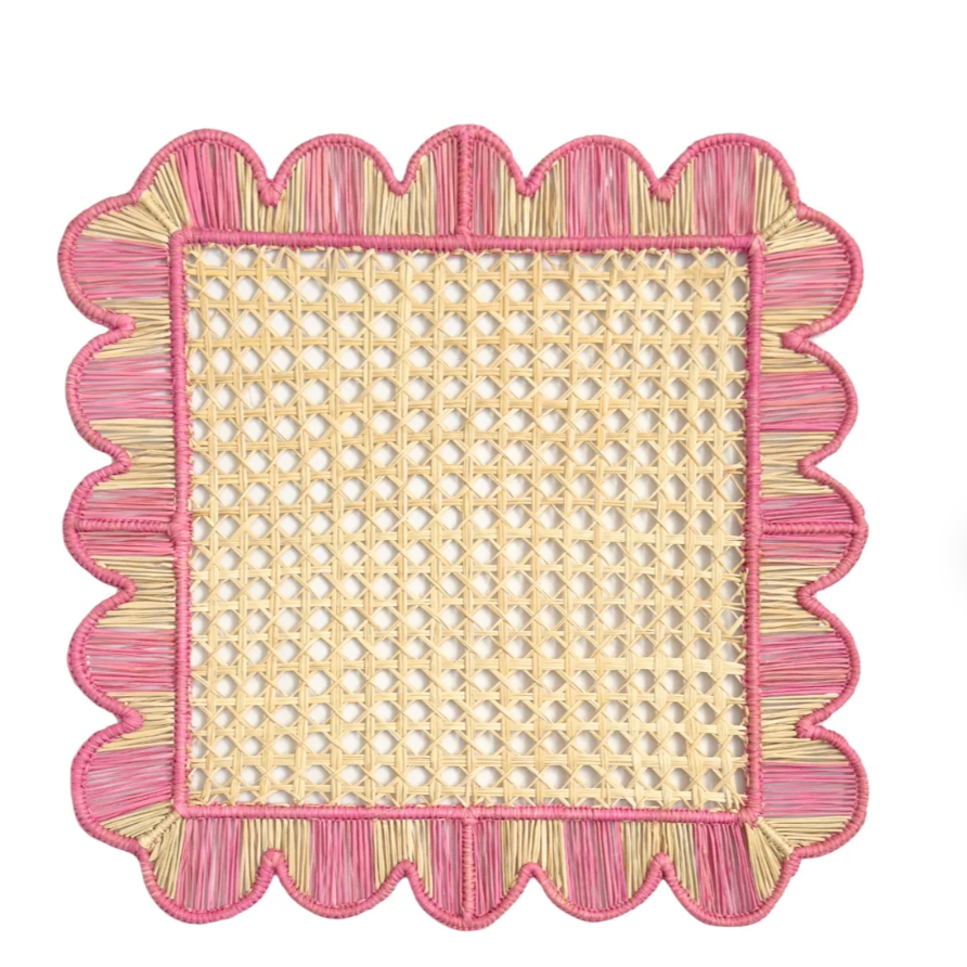 The Mercado Placemat Set of 4 in Light Pink by Coro Cora features a charming woven design, perfect for adding an artisanal touch to your table setting or pairing with handcrafted decor for a cozy, organic look.