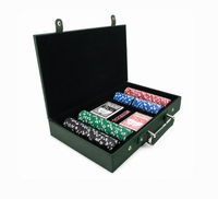 The Rowan 200 Chip Poker Set by Brouk & Co features a green case with an open lid, revealing stacks of red, blue, green, black, and white chips plus two decks of playing cards—perfect for your next casino night.