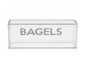 Introducing the Eye Candy Bagel Tray—a clear, rectangular acrylic box featuring the word “BAGELS” in bold gray lettering across the front. This food-safe tray, shown empty against a plain white background, is ideal for gifting or adding a touch of style to your countertop organization.