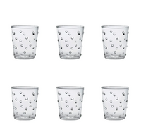 Six Party Dots Large Tumblers by Zafferano, each 15.2oz and crafted from clear borosilicate glass, are arranged in two rows of three against a plain white background. Each tumbler features a classic textured pattern with raised, round dots on the surface.
