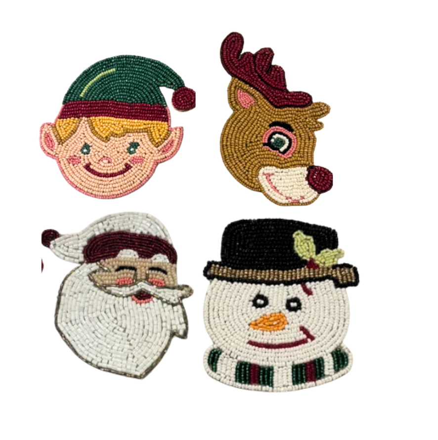 Bodrum Yuletide Tales Coaster Set of 4 featuring the faces of an elf, a reindeer, Santa Claus, and a snowman.