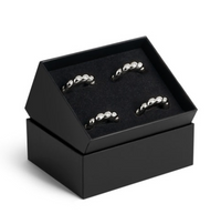 Set of four silver-toned, shell-inspired Jessica McCormack Shell Napkin Ring Set of4 - Platinum napkin rings presented in a luxury gift box.