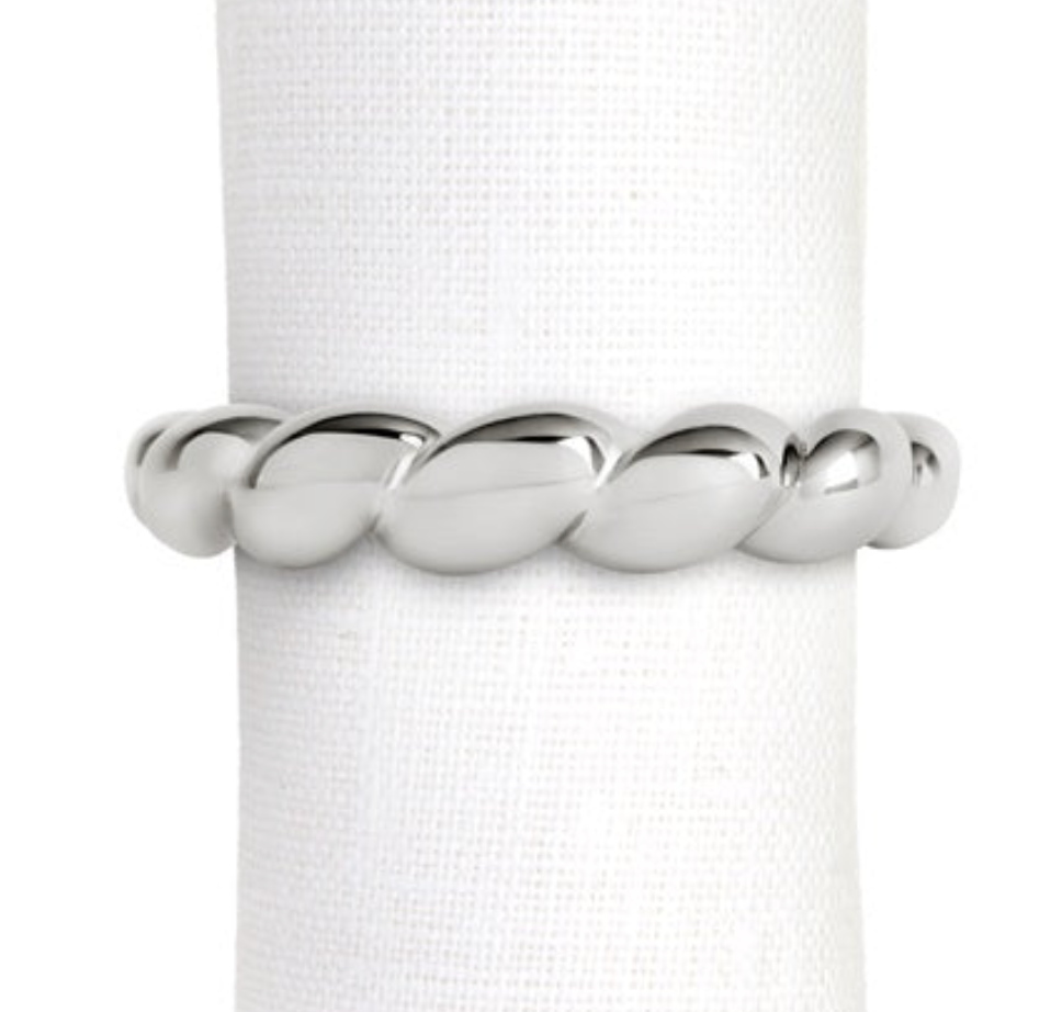 A silver-tone, shell-inspired twisted rope-pattern Jessica McCormack Shell Napkin Ring Set of 4 - Platinum encircling a white cloth napkin.