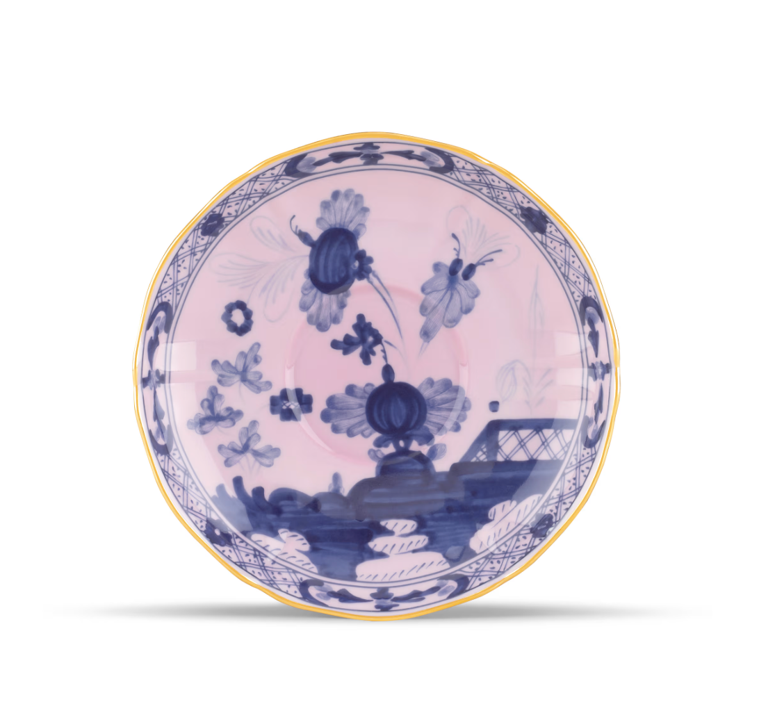 Pink Ginori 1735 Oriente Italiano Dinnerware Azalea ceramic saucer featuring blue chinoiserie floral patterns and a gold-toned rim.