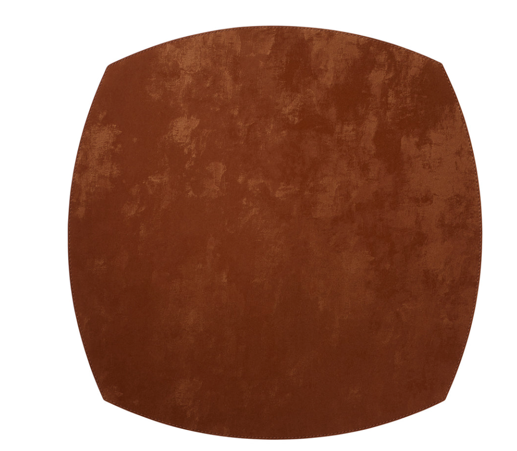A rust-colored, elliptical square Velvet Elliptic Square Placemat with stitched edges.