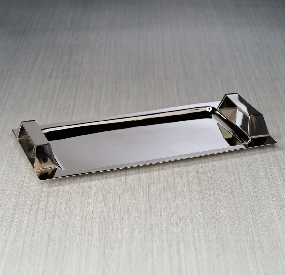 Zodax Belmont Rectangle Bar Tray in polished nickel with raised, horn-trimmed handles on both sides.
