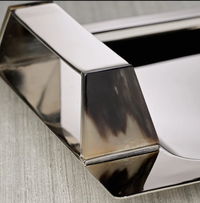 Close-up of a Zodax Belmont Rectangle Bar Tray in polished nickel, featuring a handle with a dark, marbled inlay on its side.
