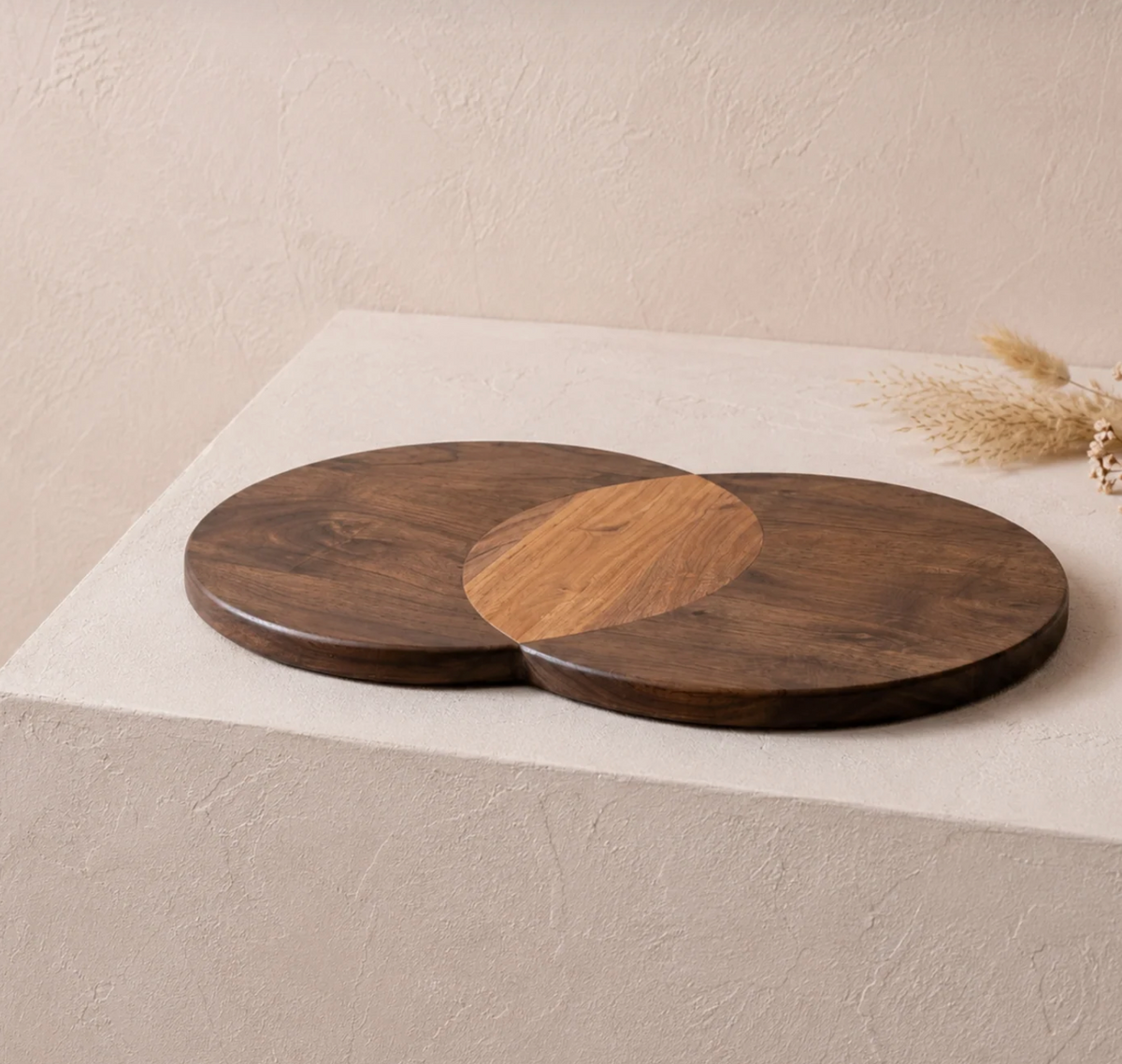 Two overlapping Erin Cheeseboard - Circles acacia wood serving boards with a contrasting light wood accent in the center.