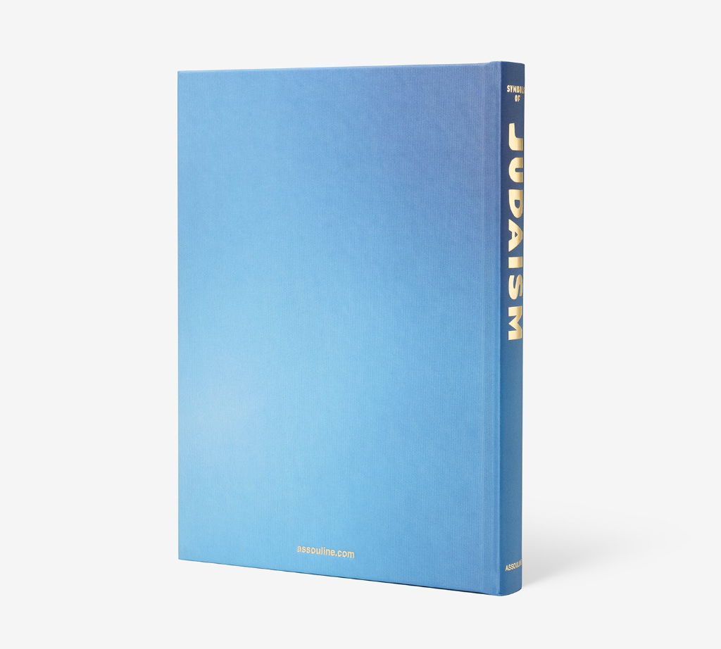 A hardcover Assouline book titled Symbols of Judaism, featuring a blue gradient cover and gold foil lettering on the spine.