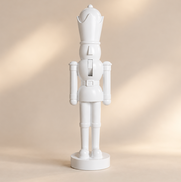 A 3ft Soldier Nutcracker Statue White by Zodax, a 3-foot-tall white soldier nutcracker standing on a circular base as holiday décor.