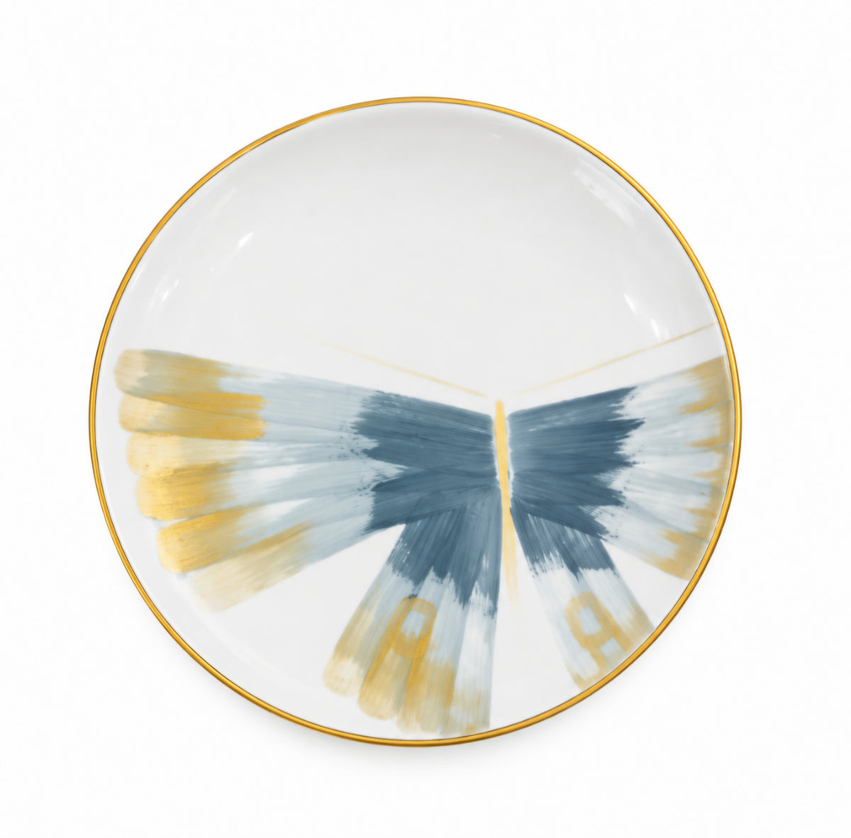 Marie Daâge Belle De Nuit 1 white Limoges porcelain plate with a gold rim featuring a blue and gold abstract butterfly wing design.
