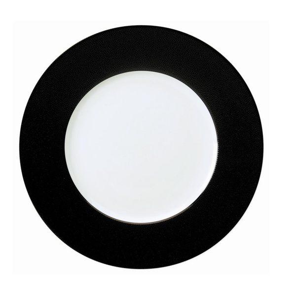 The Seychelles Dinner Plate Black 11" by Philippe Deshoulieres is crafted in Limoges porcelain with a textured black rim and glossy white center, shown top-down against a white background.