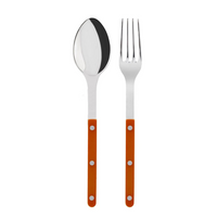 The Sabre Bistrot Shiny Solid Serving Set includes a metal spoon and fork with shiny silver heads and orange handles accented by three silver rivets, displayed side by side on a white background for Parisian style.