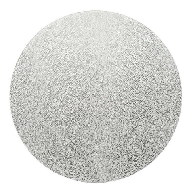 The Kim Seybert Pebble Placemats Set of 4 features large, round placemats with a uniform small-dot pattern on a white background, offering a subtle yet intricate look—perfect for elevating elegant table settings.
