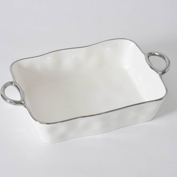 The PAMPA BAY Silver Handle Rectangle Baker, featuring wavy edges, elegant silver trim, and two silver handles, is displayed on a plain light background.
