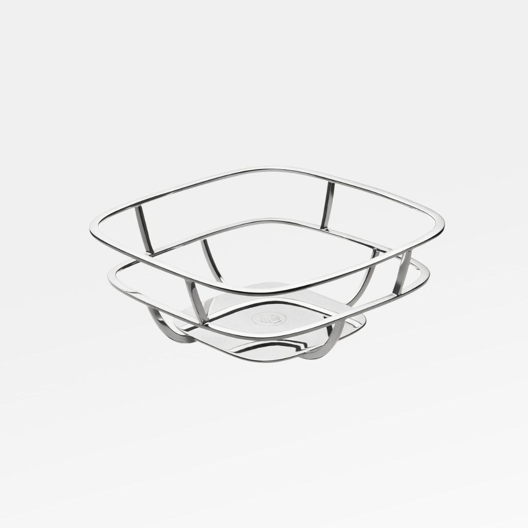 The Christofle Silver Time Bread Basket features a polished silver-plated finish, a square opening, and a double-layered wavy base—ideal as an eye-catching fruit basket centerpiece.