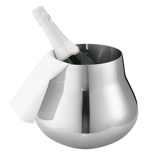 The Georg Jensen Sky Champagne & Wine Cooler, with its shiny stainless steel finish, holds a champagne bottle, elegantly draped with a white cloth over the side.
