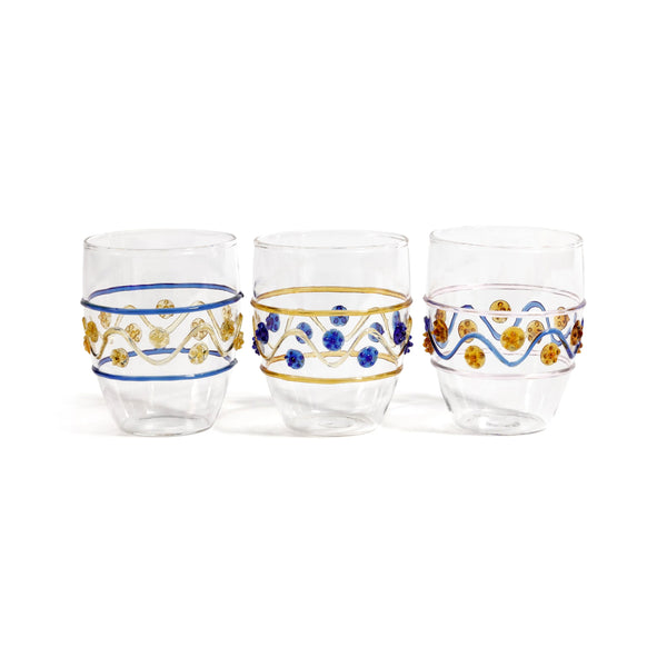 Three Festa Tumblers by Zodax in green, amber, and blue tones, each adorned with wavy lines and dots, are displayed side by side on a white background. Crafted from soda lime glass, this vibrant stemless drinkware adds flair to any setting.