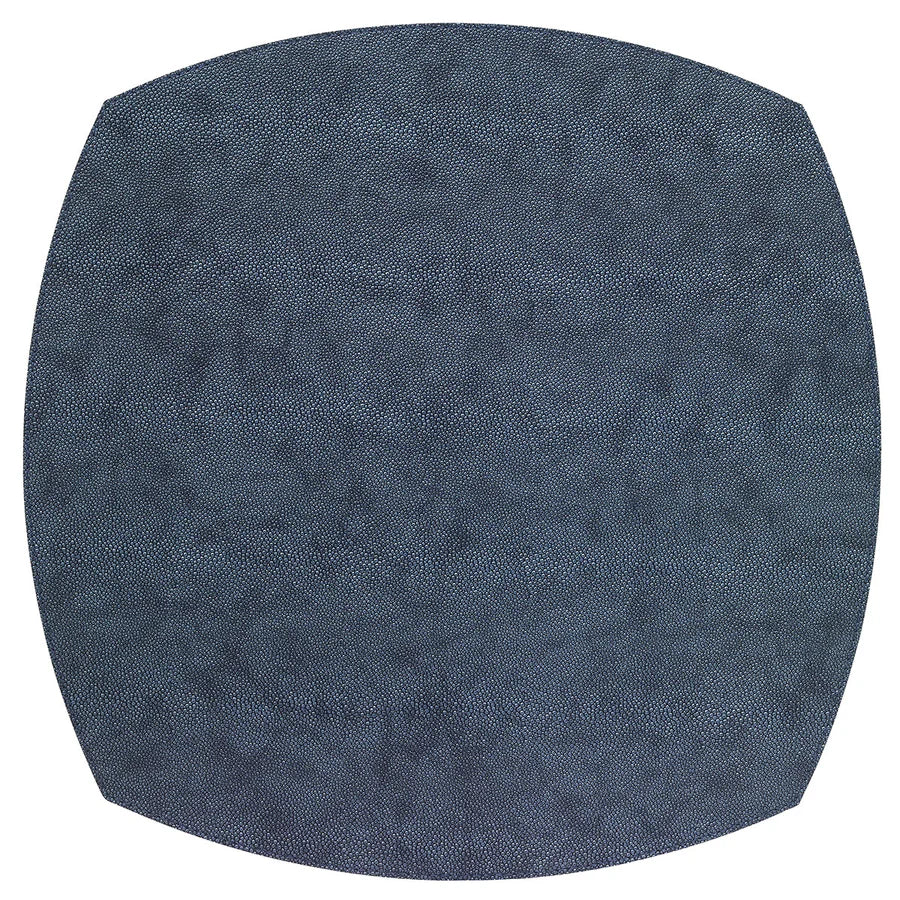 The Bodrum Stingray Elliptic Square Placemat Set of 4 features large, dark blue, slightly textured phthalate-free vinyl mats with curved edges for a modern, stylish, and safe addition to your table.