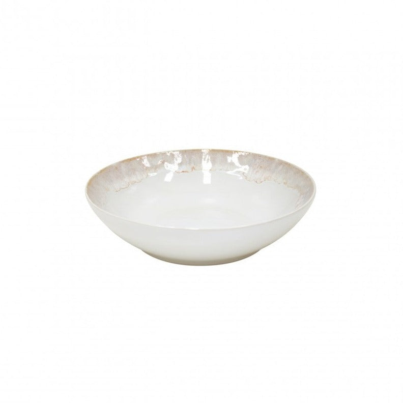 The Casafina Taormina Dinnerware White is a shallow, round stoneware bowl with a white interior and subtle beige textured rim, elegantly set against a plain white background.