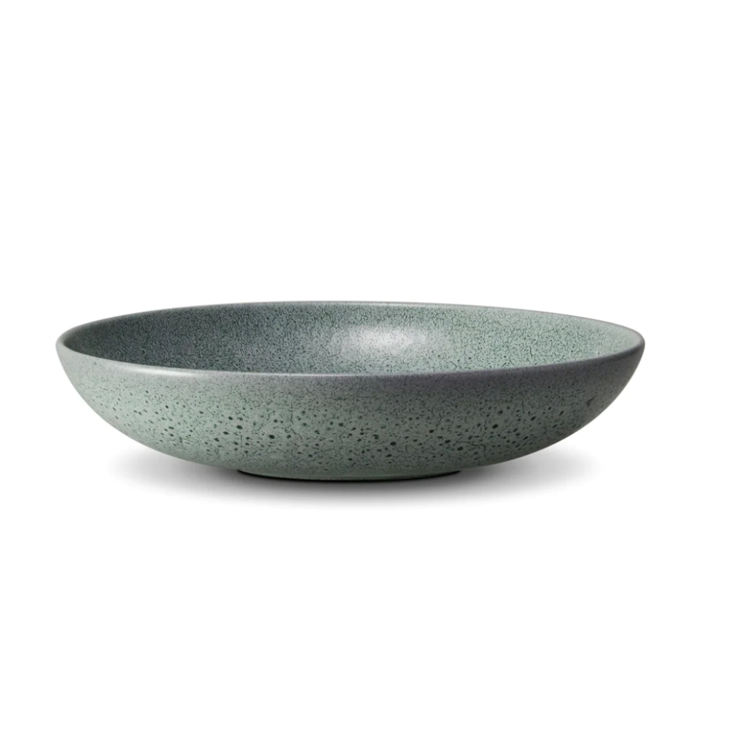 The L'Objet Terra Seafoam Dinnerware, a handcrafted green ceramic bowl with a matte finish and smooth interior, is displayed against a plain white background.