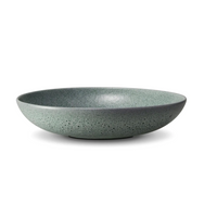 The L'Objet Terra Seafoam Dinnerware, a handcrafted green ceramic bowl with a matte finish and smooth interior, is displayed against a plain white background.