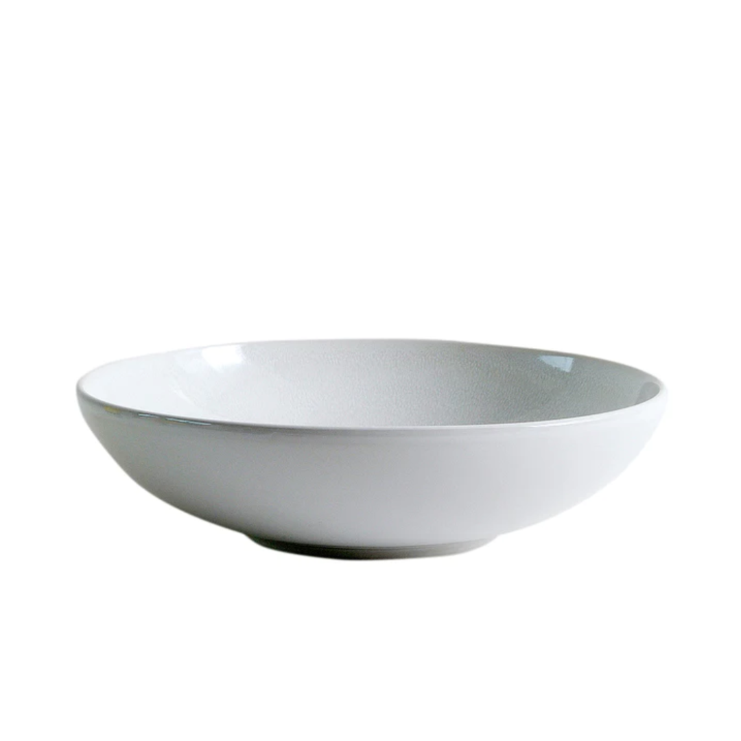 The Jars - Rosenthal Tourron Dinnerware Neige features a handmade, shallow white ceramic bowl with a smooth surface, crafted in France and shown on a white background.