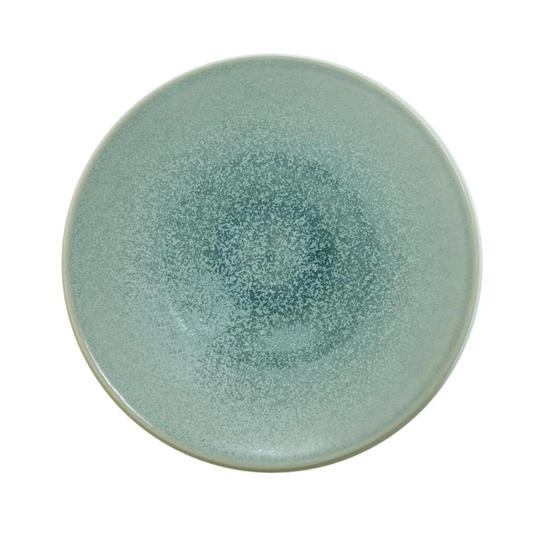 A round, shallow Eucalyptus Tourron dinner plate by Jars - Rosenthal with a speckled, textured green finish.