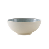 A rounded, microwave-safe Jars - Rosenthal Tourron Dinnerware Eucalyptus ceramic bowl with a cream-colored exterior and a speckled, light green interior designed for modern everyday use.