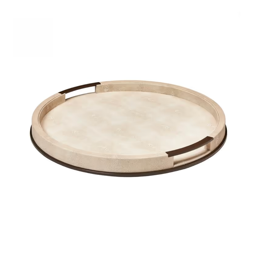 The Addison Ross Faux Shagreen Tray Ecru - Round - Large is a beige accent piece featuring two rectangular cutout handles and a smooth, subtly textured surface. Resting on a flat white background, this tray brings an elegant touch to luxury home décor.