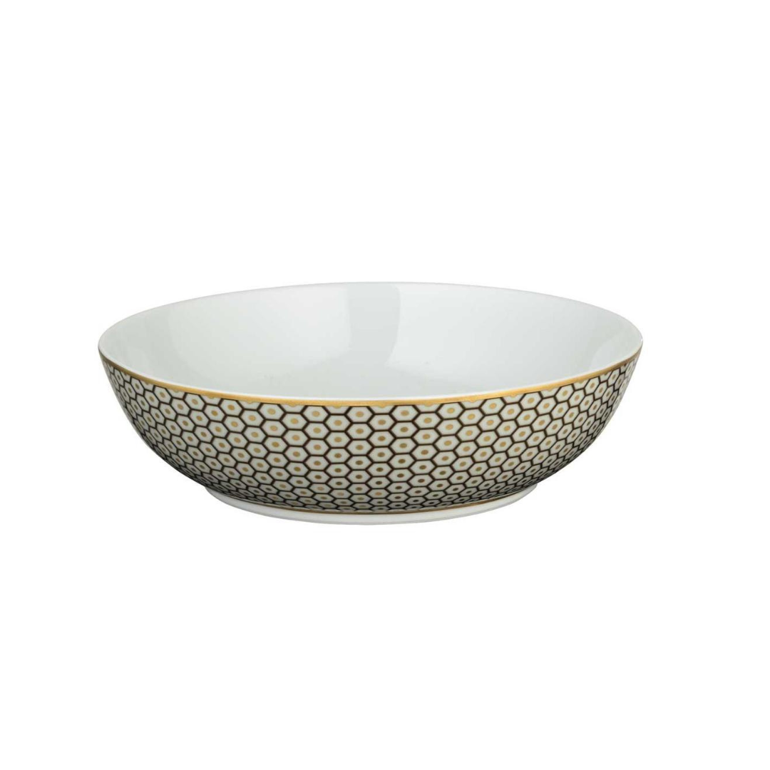A shallow white ceramic bowl from Raynaud's Tresor Dinnerware Brown, featuring a gold and black hexagonal honeycomb pattern on the outer side, inspired by Raynaud porcelain, set against a plain white background.