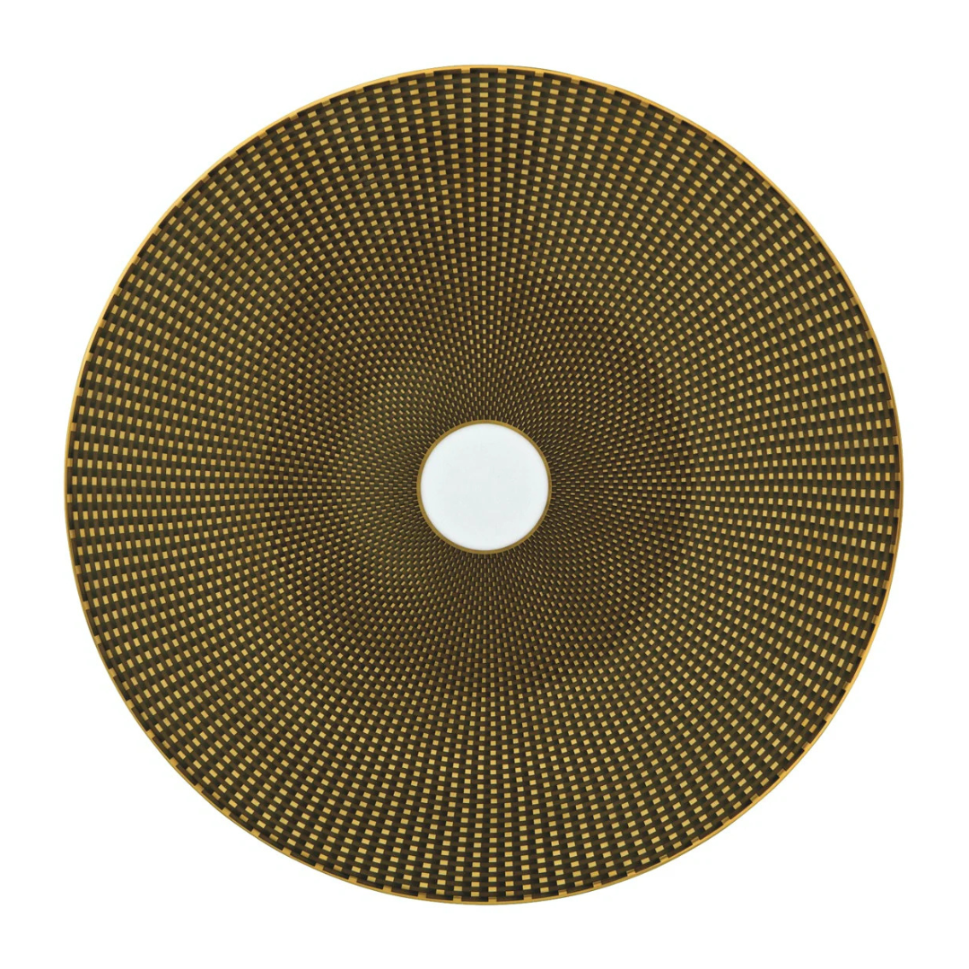 The Tresor Dinnerware Brown round plate by Raynaud features a brown and gold geometric dot pattern radiating from a white center, offering an elegant touch to formal dinnerware settings.