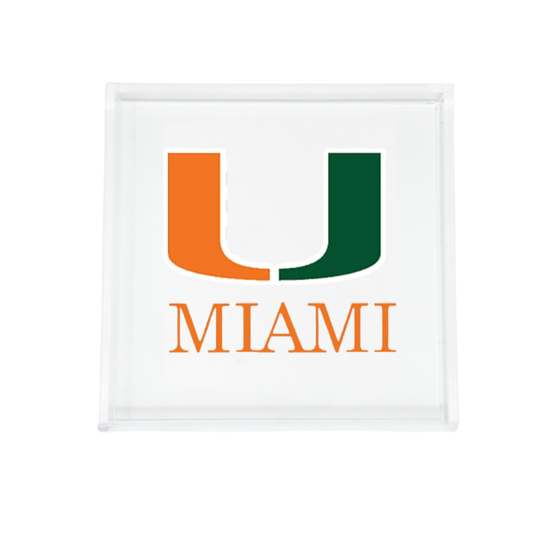 The Eye Candy College Acrylic Catchall Tray features the University of Miami logo—a split orange and green "U" above "MIAMI" in bold orange letters—making it a stylish, practical accessory for any student's dorm room or fan's space.