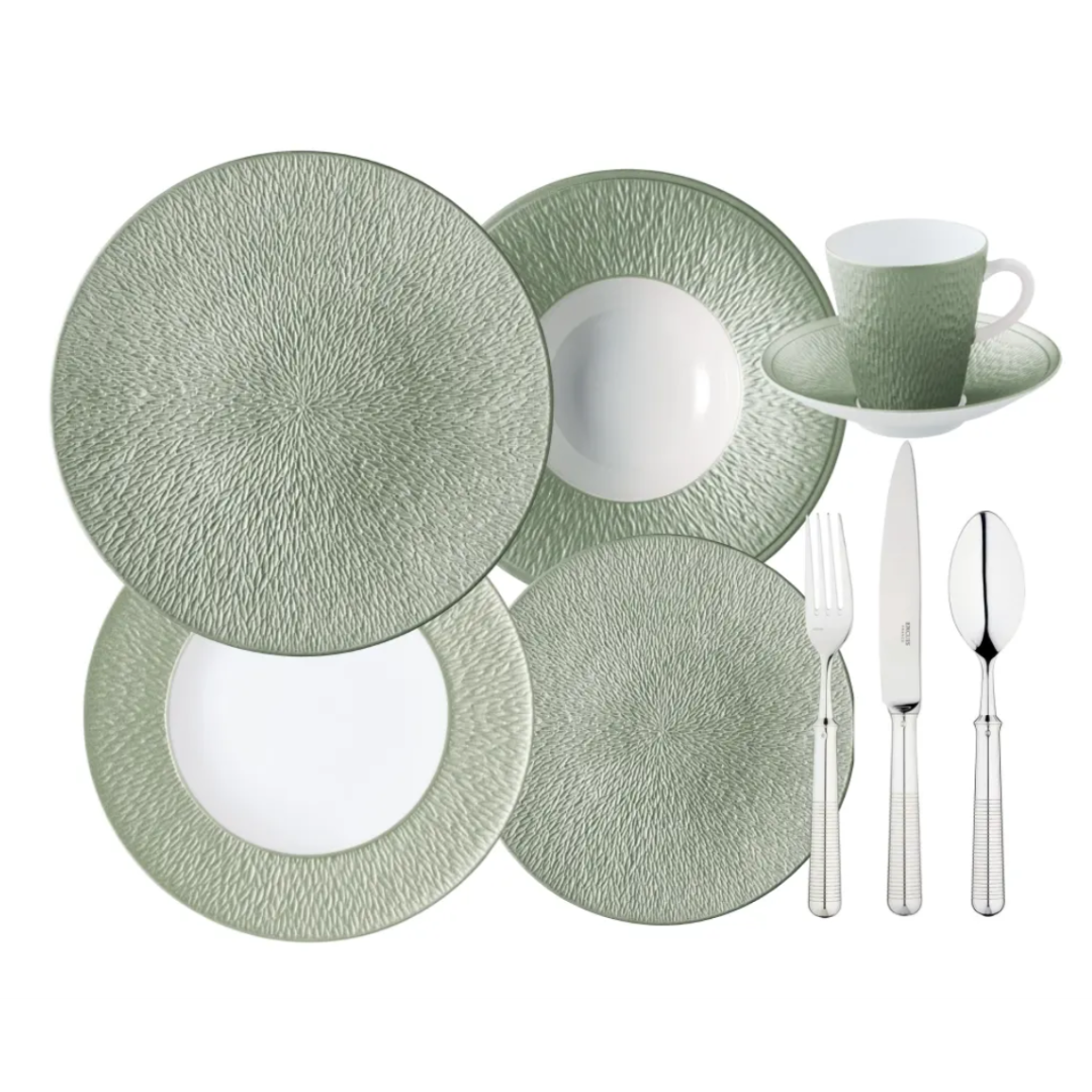 The Raynaud Mineral Irise Dinnerware - Celadon set features green and white textured Limoges porcelain with two plates, a bowl, cup and saucer, plus a fork, knife, and spoon.