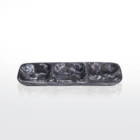 The Nashi Home Swirl Resin Classic 3 Section Tray features a rectangular black and white marbled design, shatter-resistant, food-safe resin, with three compartments. Shown on a reflective white surface with a plain background.