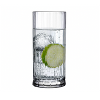 A clear Wayne Highball Glass from Nude Glassware, filled with sparkling water, ice, and a lime slice on a white background—perfect for showcasing the elegant Wayne Highball Glass Set of 4.