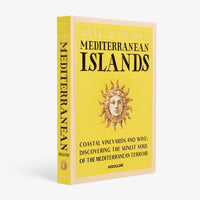 Assouline’s “Wine & Travel Mediterranean Islands” is a yellow hardcover book with an illustrated sun face, offering vineyard guides and wine tourism insights that reveal the sunlit soul of Mediterranean Islands wine.