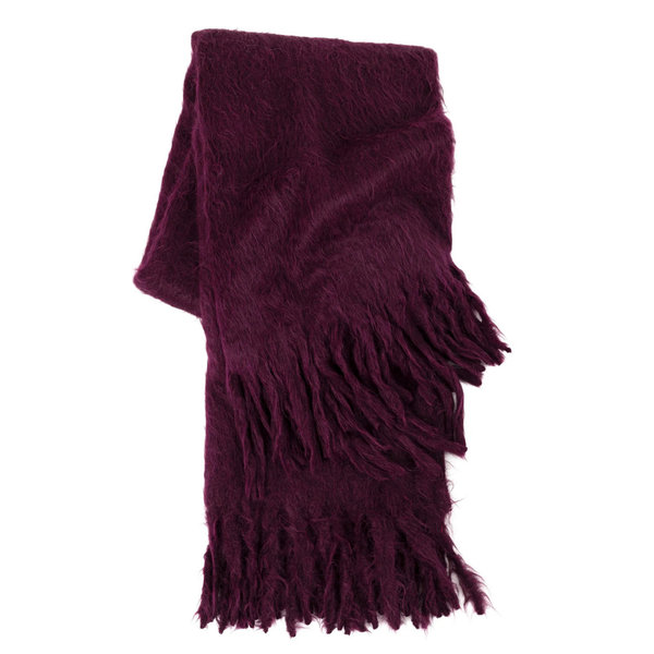 The Dove & Donkey Woolly Mammoth Throw is a folded deep purple scarf with a fuzzy, silky-soft texture and long fringe at both ends, displayed on a white background.