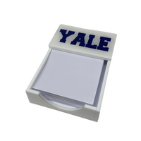 The Eye Candy College Note Pad features a white holder with blank square papers and YALE in bold blue letters on the lid—an ideal graduation gift.