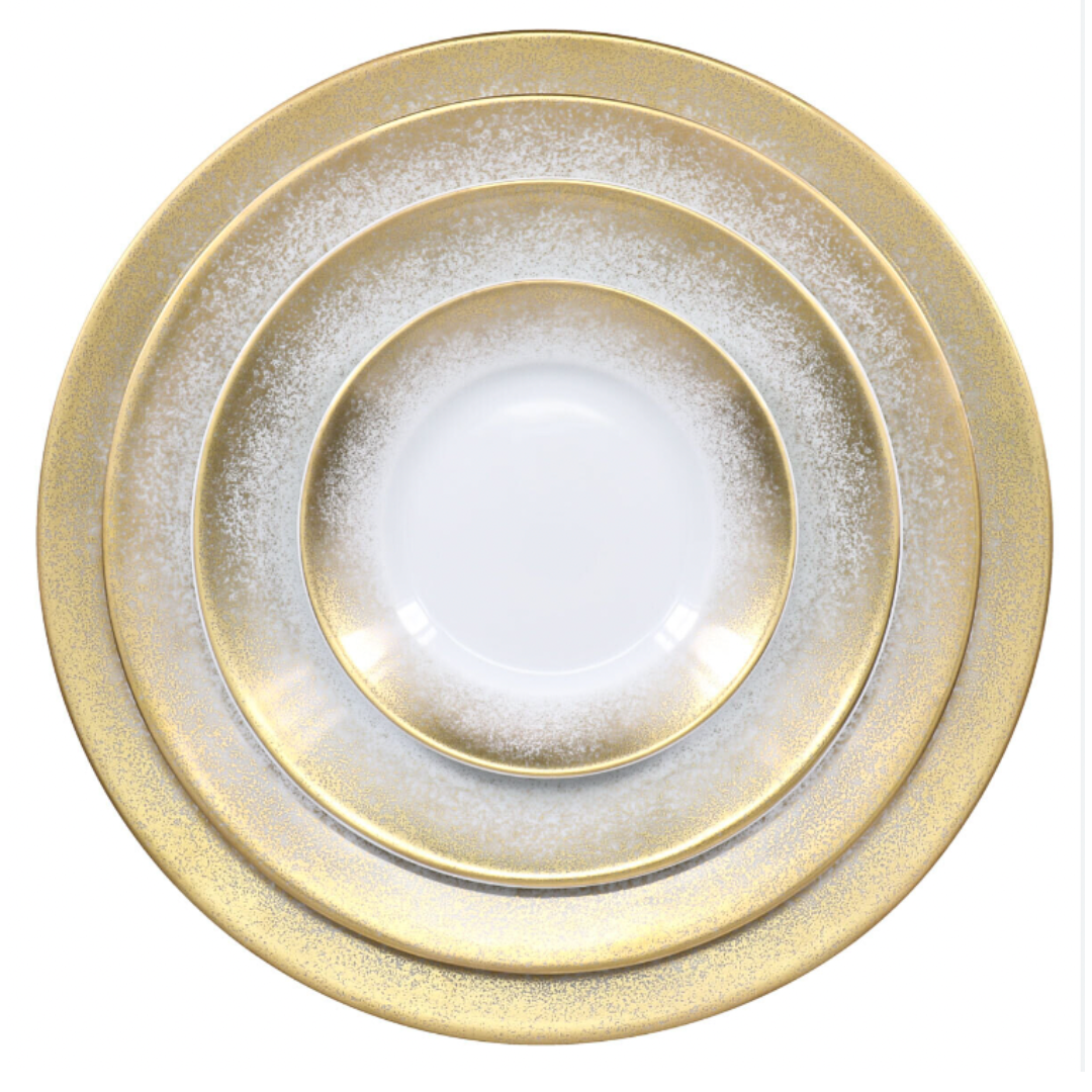 The Royal Limoges Yellow Fire Dinnerware set features three round Limoges porcelain plates with white centers and sparkling yellow gold rims, stacked from largest to smallest against a white background.