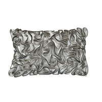 The Threads Soft Goods Zipper Pillow Natural 13 x 20 is a rectangular, handcrafted pillow with a white base and textured black embroidered wavy lines and loops in an abstract ribbon pattern.